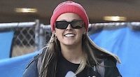 JoJo Siwa is left in tears after arriving back in LA