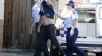 Thomas Graham Towle, 34, being taken from a holding cell at Mildura Police station to stand before a magistrate at Mildura Court, Monday, Feb. 20, 2006. Towle has been accused of driving the car that killed six teenagers at Cardross near Mildura on the weekend. (AAP Image/Glenn Hunt) NO ARCHIVING