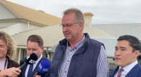 Accused chicken killer Peter Smith (centre) with his defence lawyer Bryan Wrench (right)