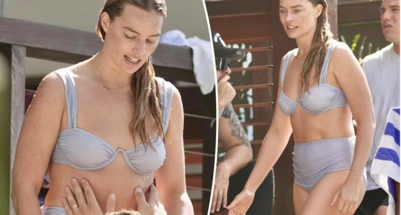 Margot Robbie flaunts fit physique during Australian beach outing with husband Tom Ackerley