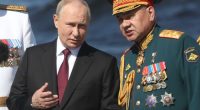 SAINT PETERSBURG, RUSSIA - JULY 30 (RUSSIA OUT) Russian President Vladimir Putin (L) talks to Defense Minister Sergey Shoigu (R) during an annual Navy Day Parade, on July 30,2023, in Saint Petersburg, Russia. President Putin with 4 African leaders who participated in the Russia-African Summit, reviewed the Naval Day Main Parade on the Neva river. (Photo by Contributor/Getty Images)