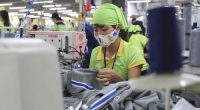 A worker sews a garment at Pro Sports factory in Nam Dinh province, Vietnam