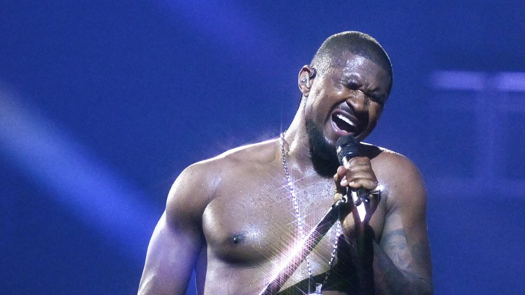 Usher surprises fans by bringing American Boy onstage at O2 show