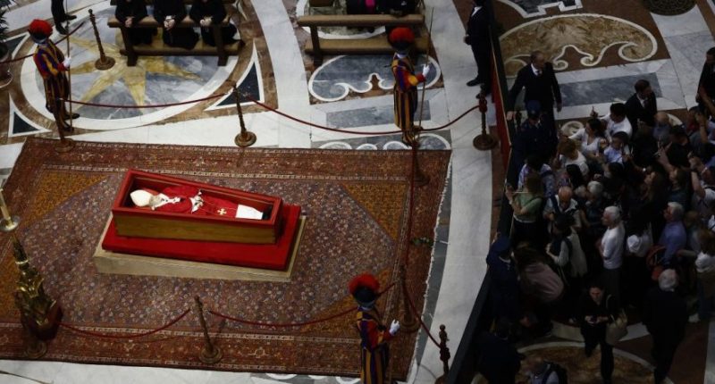 People queue to pay their respects to the late Pope Francis, who will lie in state at St. Peter's Basilica for three days, at the Vatican, Wednesday, April 23, 2025. (Cecilia Fabiano/LaPresse via AP)