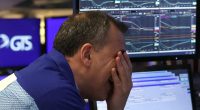 Wall Street drops 20% below its record and markets plunge worldwide as Trump digs in on tariffs