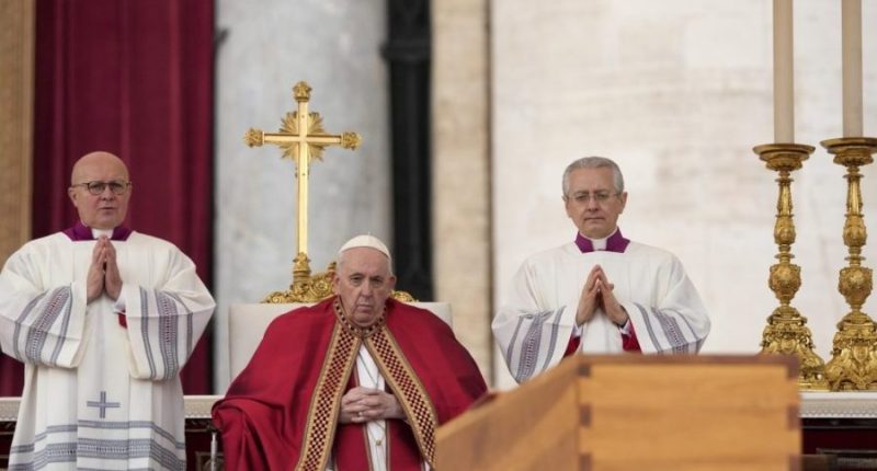 Pope Francis sits by the coffin of late Pope Emeritus Benedict XVI in St. Peter's Square during a funeral mass at the Vatican, on Jan. 5, 2023. (AP Photo/Andrew Medichini, File)
