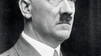 Black and white portrait photograph of Adolf Hitler.