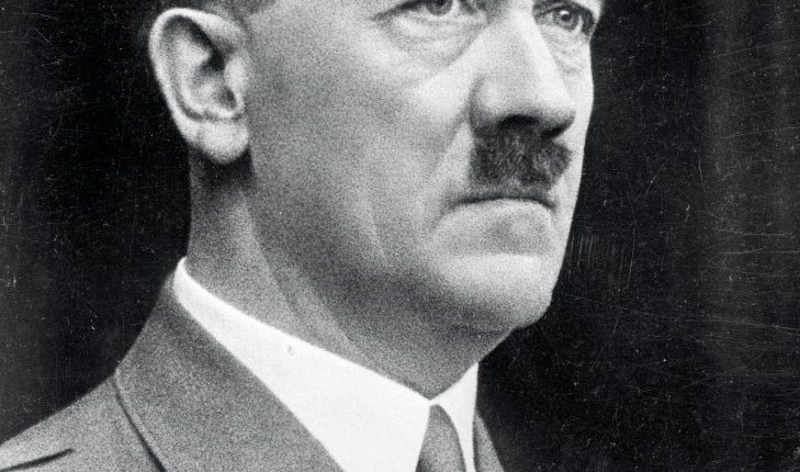 Black and white portrait photograph of Adolf Hitler.