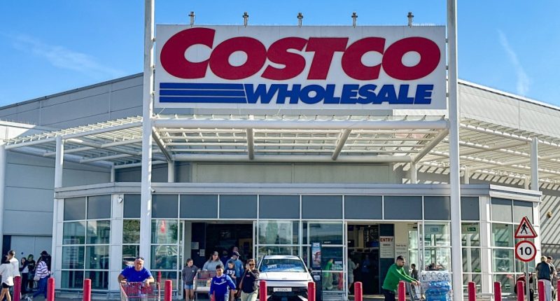 People entering and leaving a Costco Wholesale store.