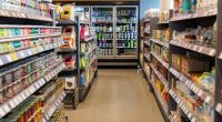 Supermarket aisles stocked with various products.