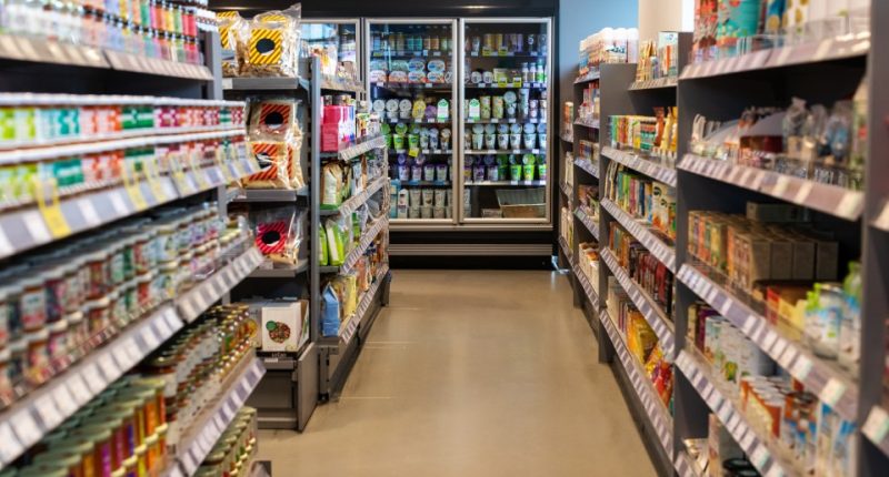 Supermarket aisles stocked with various products.