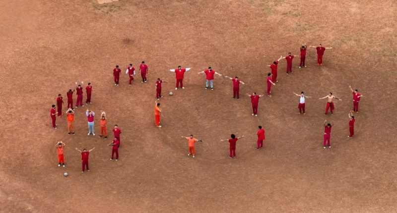 Aerial view of detainees at the Bluebonnet Detention Facility spelling out SOS with their bodies.
