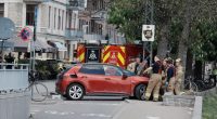 Police and rescue workers at the scene of a car accident in Copenhagen.