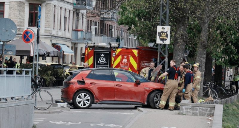 Police and rescue workers at the scene of a car accident in Copenhagen.
