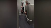 American Airlines passenger restrained, knocked to floor while barging into cockpit: video