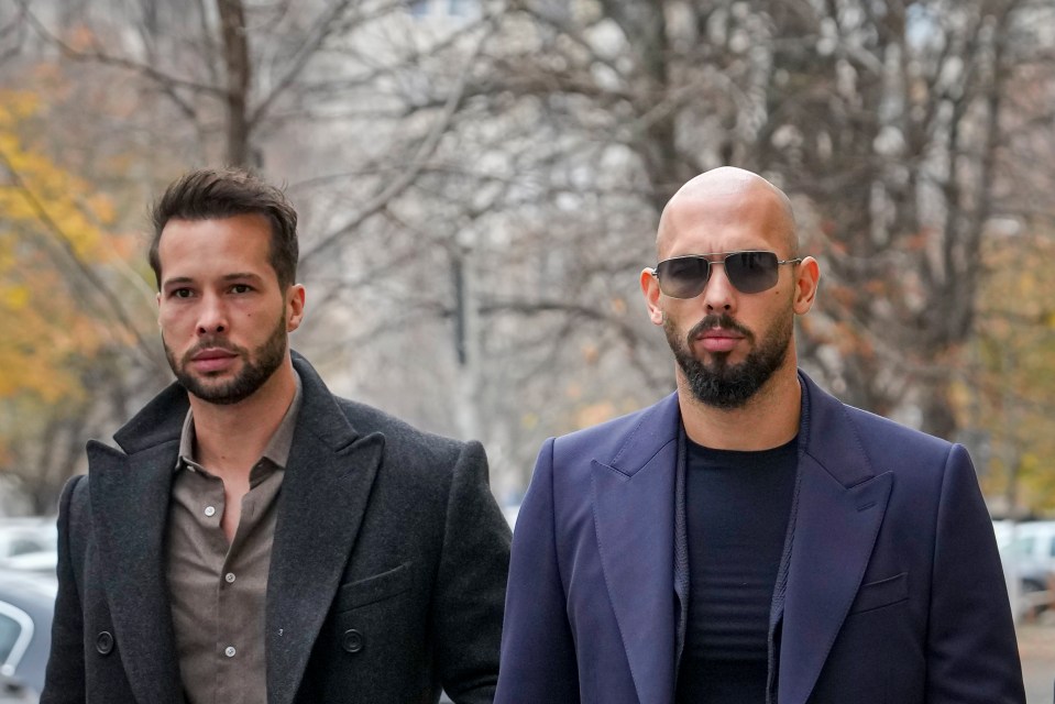 Two men in suits outdoors.