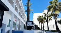 Ibiza Rocks Hotel entrance with palm trees.