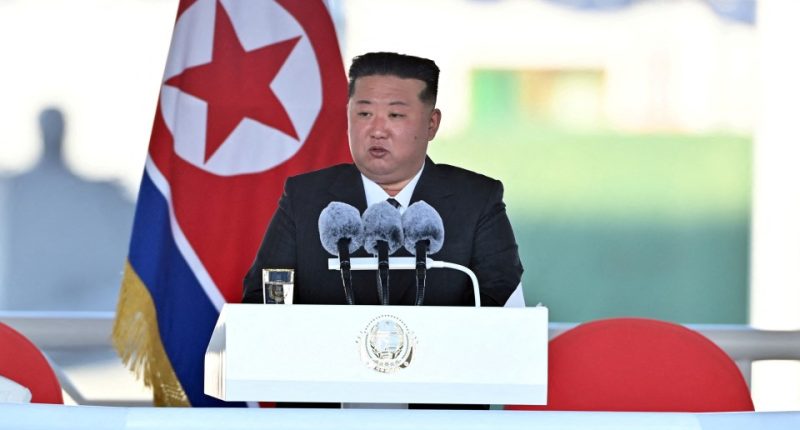 Kim Jong Un observing military exercises.