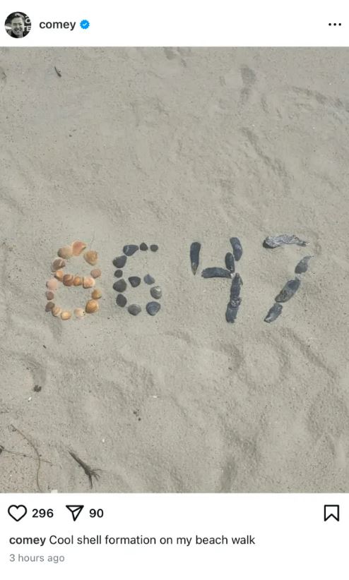 Seashells arranged to form the numbers 8647 in the sand.