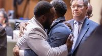 Cops hug and cry as they're CLEARED in death that shocked America