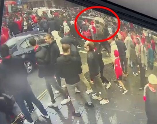 Security camera footage of a car driving into a crowd of Liverpool fans.