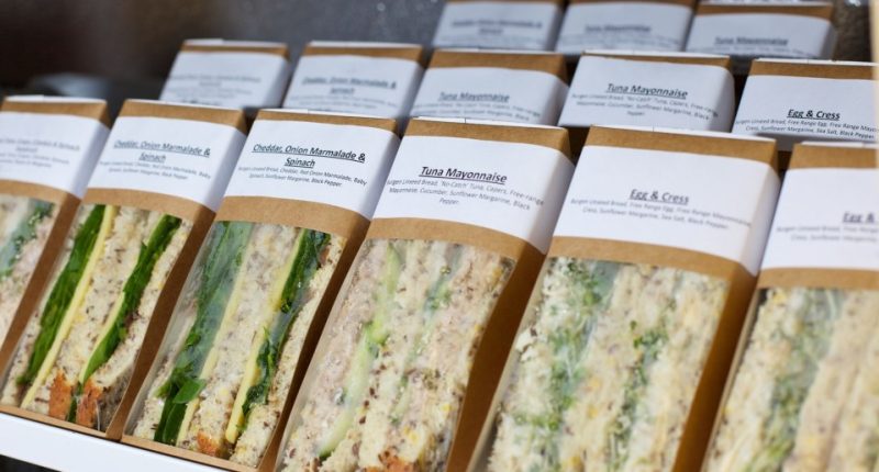 Assortment of individually packaged sandwiches.