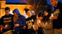 Students hold a candlelight vigil.