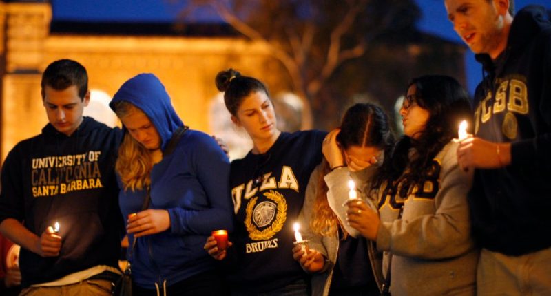 Students hold a candlelight vigil.