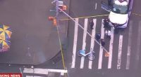 Aerial view of a Times Square shooting scene; a man was shot in the arm, suspect at large.