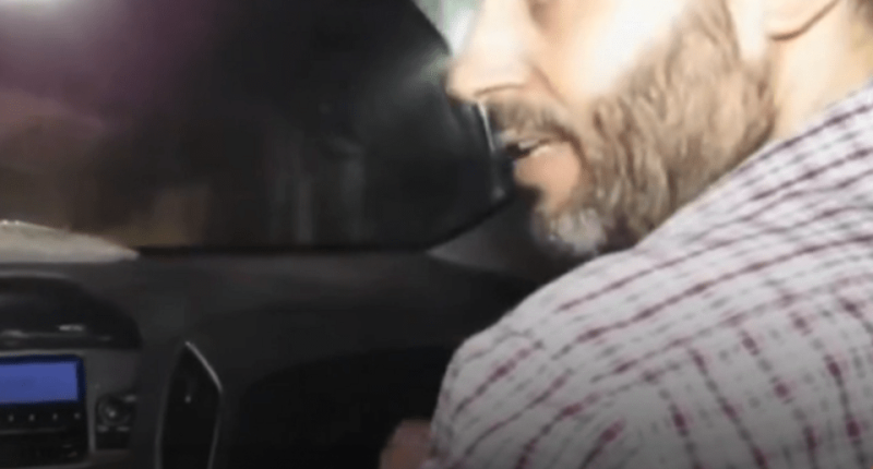 Man speaking in a car.