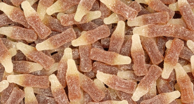 Many cola-bottle-shaped gummy candies.