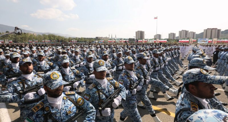 Iranian soldiers marching in a military parade.