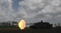 Ukrainian tank crew firing a Leopard 2A4 tank.