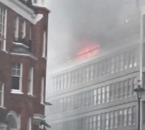 Building fire with smoke.