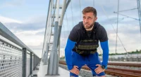 man getting tired during walk with weighted vest