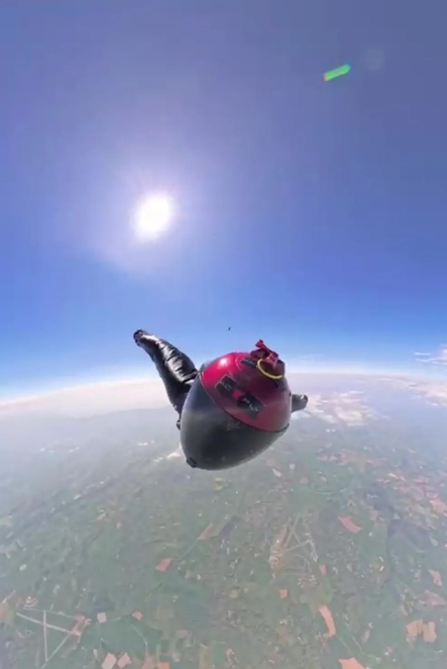 Skydiver falling from a great height.