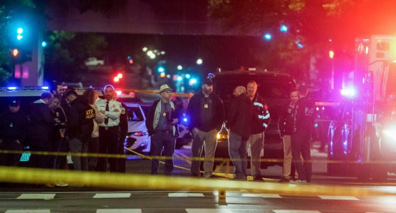 Police officers at a crime scene near the Capital Jewish Museum in Washington, D.C.