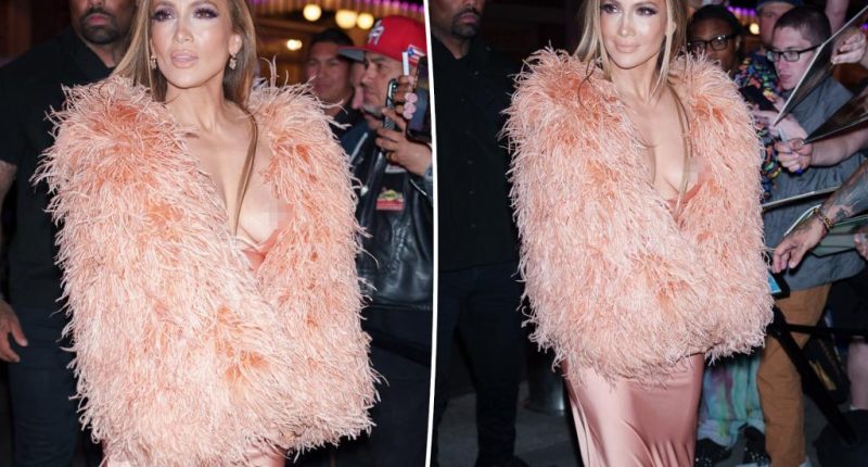 Jennifer Lopez suffers wardrobe malfunction in plunging peach gown