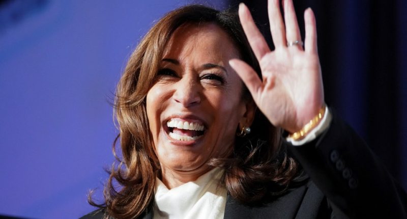 Kamala Harris waving and smiling.