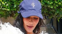 Kim Kardashian teams her feathered gown with a baseball cap