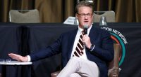 Joe Scarborough speaking at a luncheon.