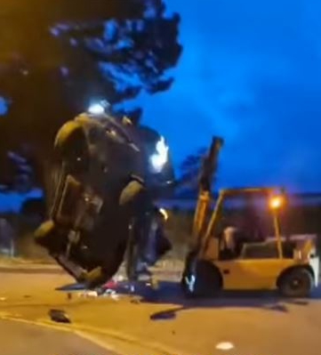 Forklift flipping a car.