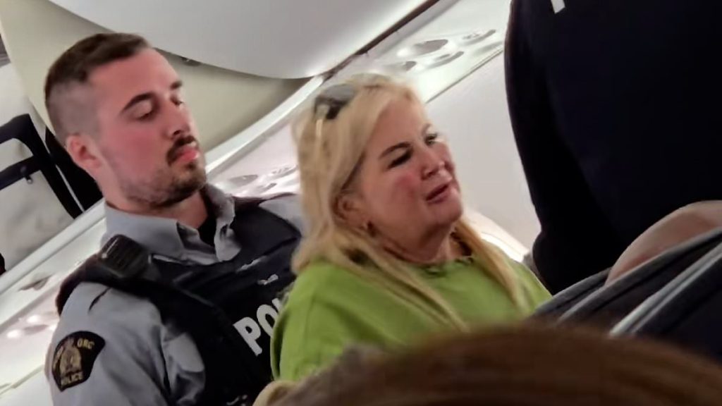 Moment 'mother and daughter' taken away by police on flight to Jamaica