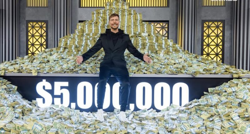 Man sitting on a large pile of money; $5,000,000 displayed.