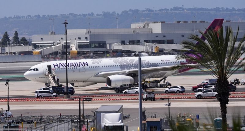 Hawaiian Airlines plane on tarmac after evacuation at San Diego International Airport.