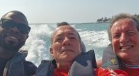 Three men on a boat.