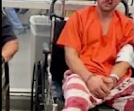 Injured inmate in wheelchair.