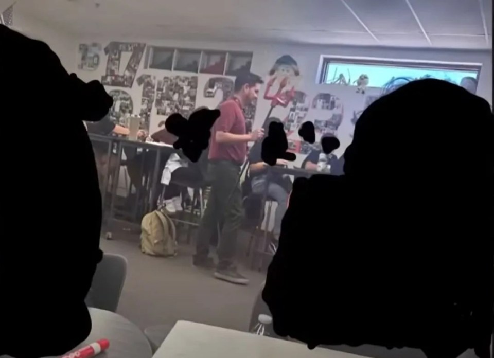 Teacher dressed as devil in classroom.