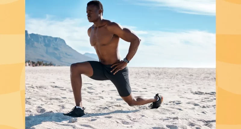 fit man doing walking lunges at the beach on sunny day