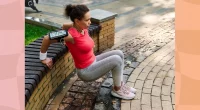 middle-aged woman doing tricep dips on wall at park